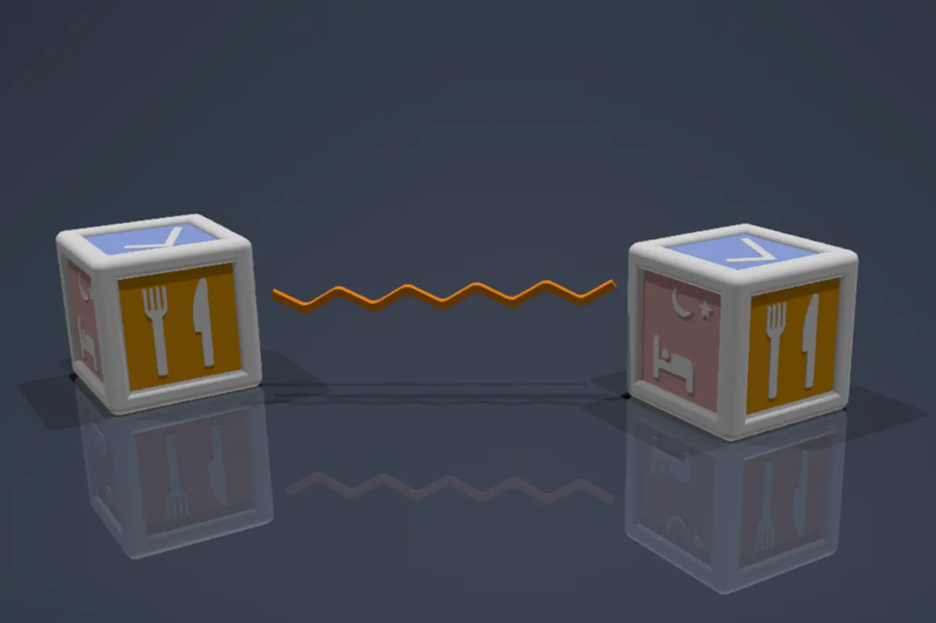 Two smart communication cubes with meal and bedtime symbols